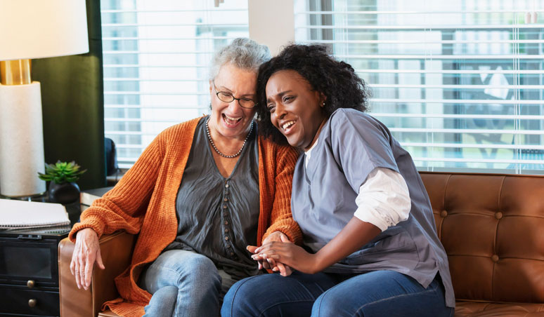 senior patient on couch with social worker