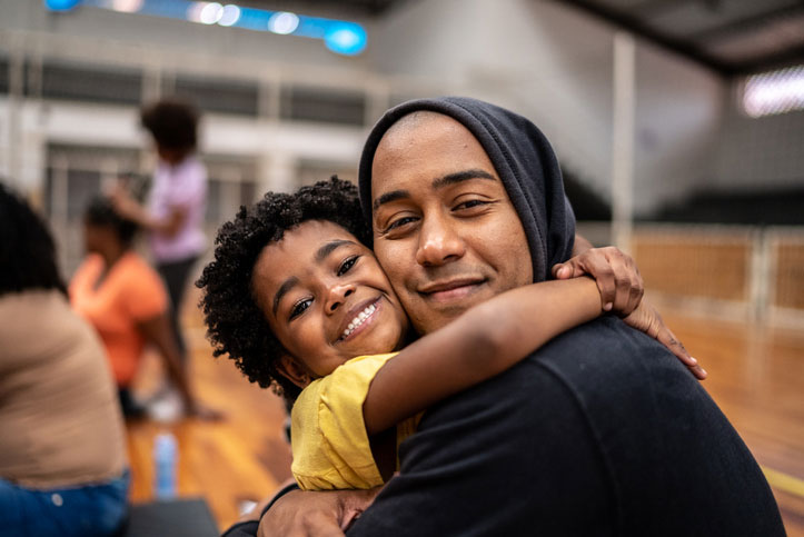 unhoused family hugging