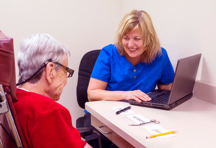 elderly woman getting assistance