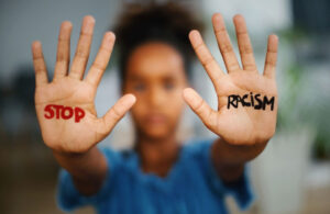 stop racism painted on hands