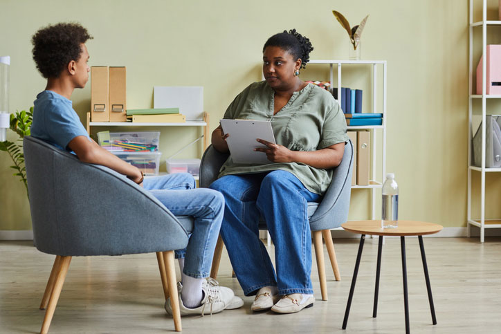 school social worker talking with teen