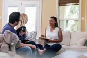 family talking with social worker in her office