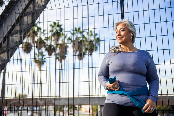 older woman exercising outside