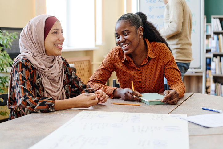 joyful women at desk