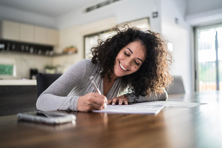 young woman filling out paperwork