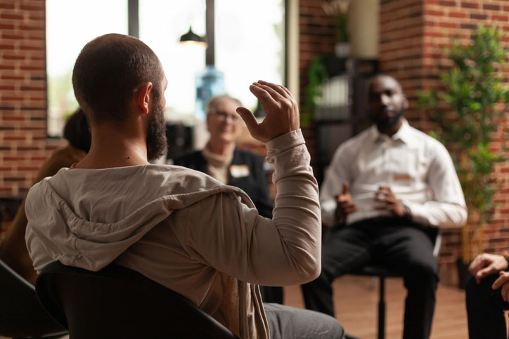 man with addiction sharing struggles with others