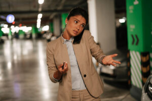 busy woman on the phone, in parking garage