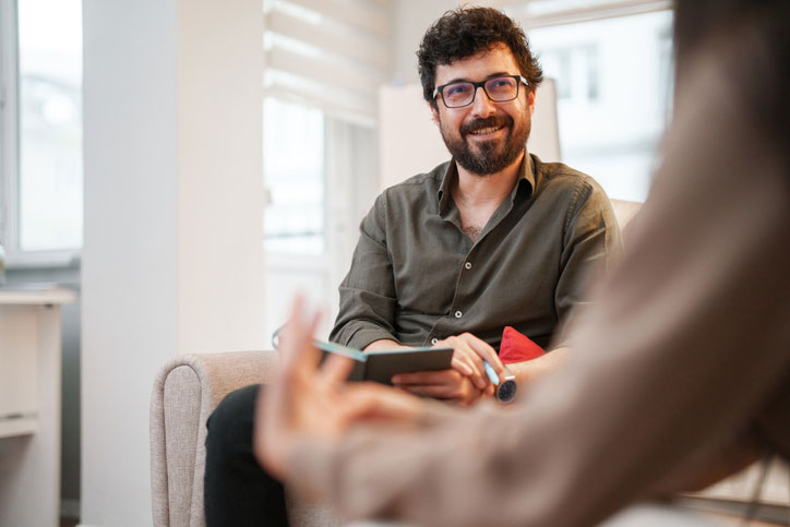 talking with social worker in his office