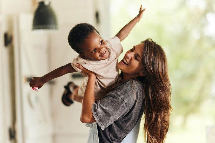 mom and young son playing