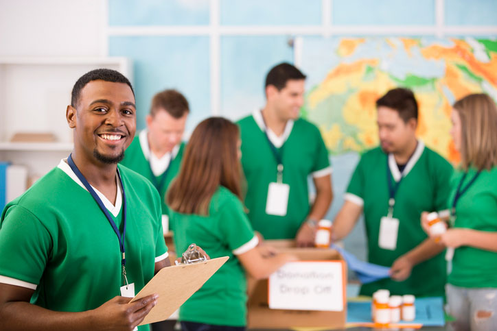 volunteers packing up medicine