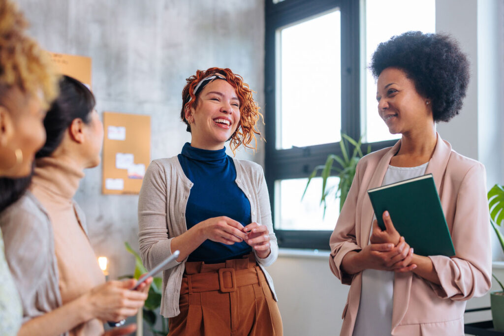 women talking in office